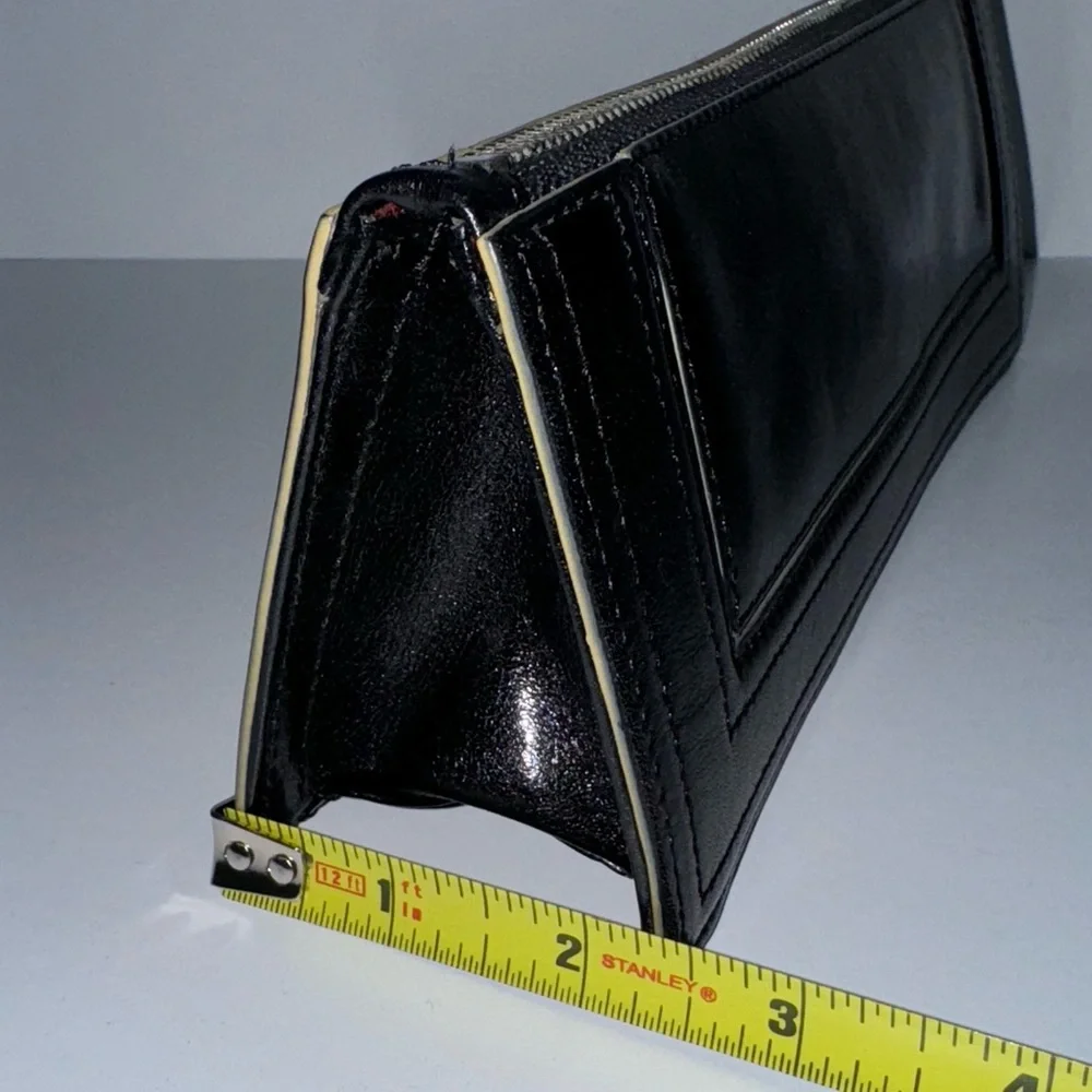 Ellen Tracy Black Leather Clutch with red logo interior.